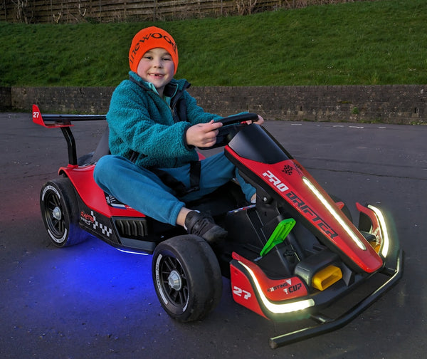 young child driving an electric go kart 24 volt power