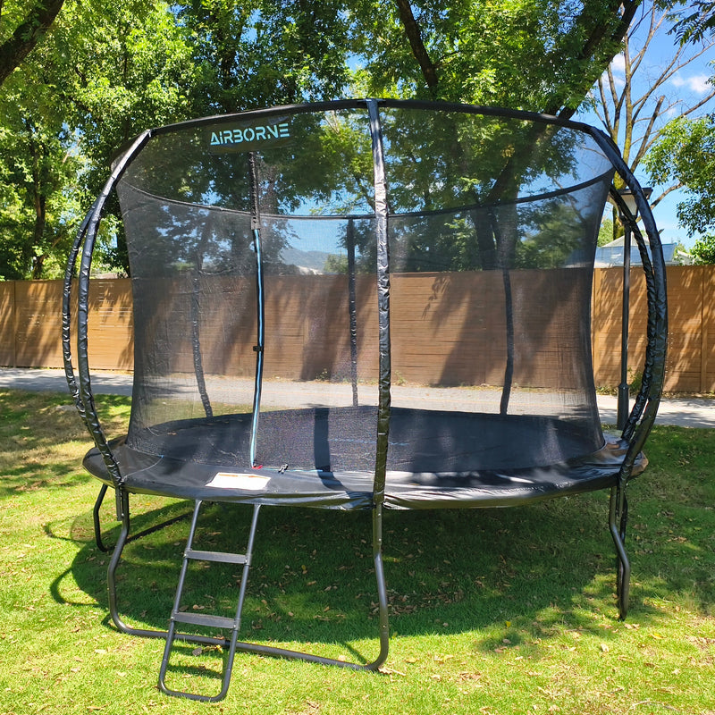 an airborne large 12ft trampoline with an added safety net and access ladder 