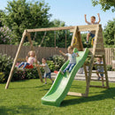 A wooden swing set with a green slide in a backyard, with children playing on the equipment under a clear blue sky.