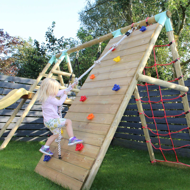 kid using a climbing frame wall with knotted climbing rope 