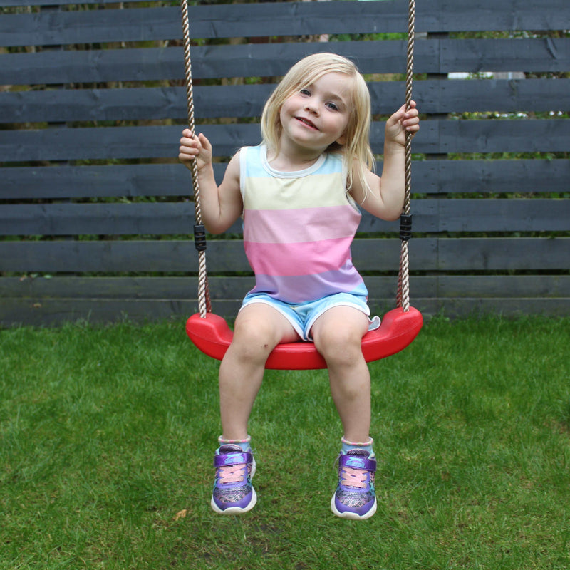 young kids on  a swing 