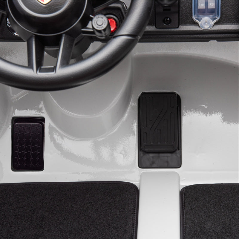 a kids porsche with brake pedal and accelerator 