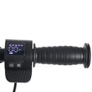 A close-up of a black electric scooter or bicycle handlebar grip with an integrated digital display showing speed and control buttons, isolated on a white background.