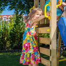 a large kids wooden play tower with slide and climbing wall 