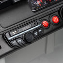 Close-up of a car dashboard audio control panel with a digital display, USB port, volume knob, and red power buttons.