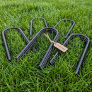 u shaped metal ground anchors or trampoline stability 