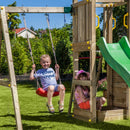 a stand alone climbing tower with slide and swing 